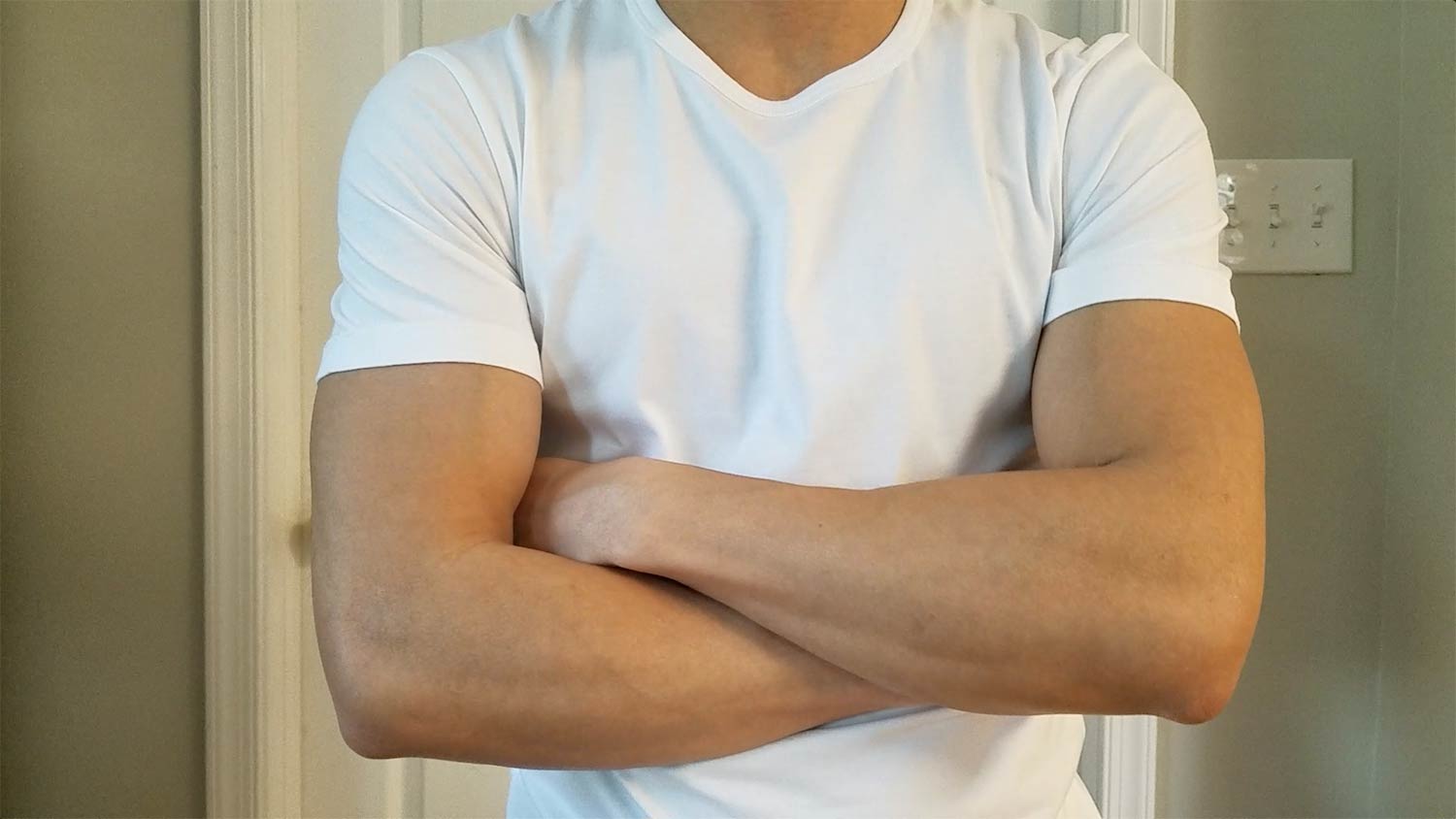 Asket White Tee Arms Folded
