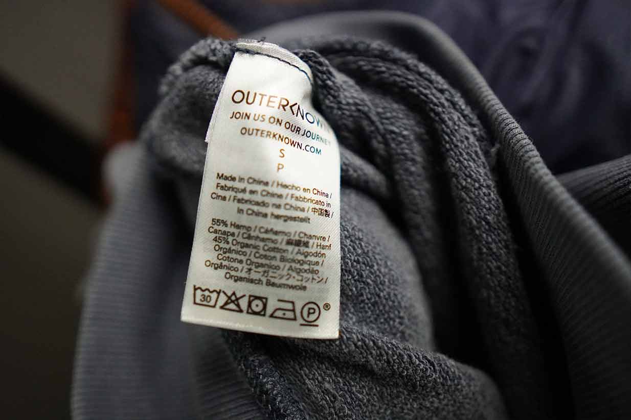 outerknown sur sweatshirt tag